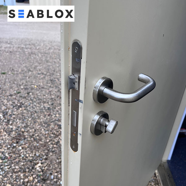 Shipping container door handle and deadbolt lock