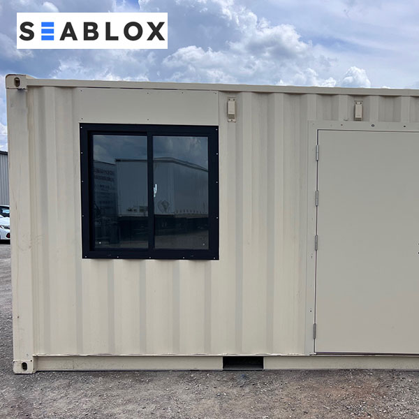 Aluminum shipping container window installed in container wall